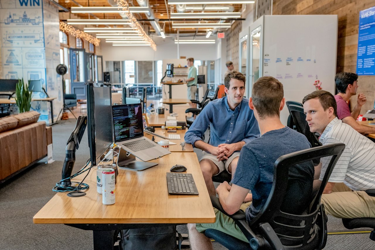 Delivery team working at desks in an open office